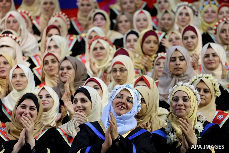 Palestinian students participate in their graduation ceremony at the Islamic University in Gaza city on July 23, 2016. Photo by Mohammed Asad