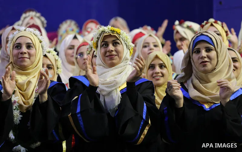 Palestinian students participate in their graduation ceremony at the Islamic University in Gaza city on July 23, 2016. Photo by Mohammed Asad