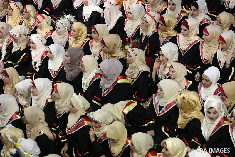 Palestinian students participate in their graduation ceremony at the Islamic University in Gaza city on July 23, 2016. Photo by Mohammed Asad