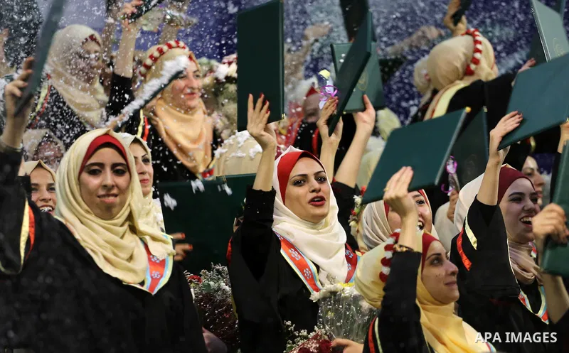 Palestinian students participate in their graduation ceremony at the Islamic University in Gaza city on July 23, 2016. Photo by Mohammed Asad