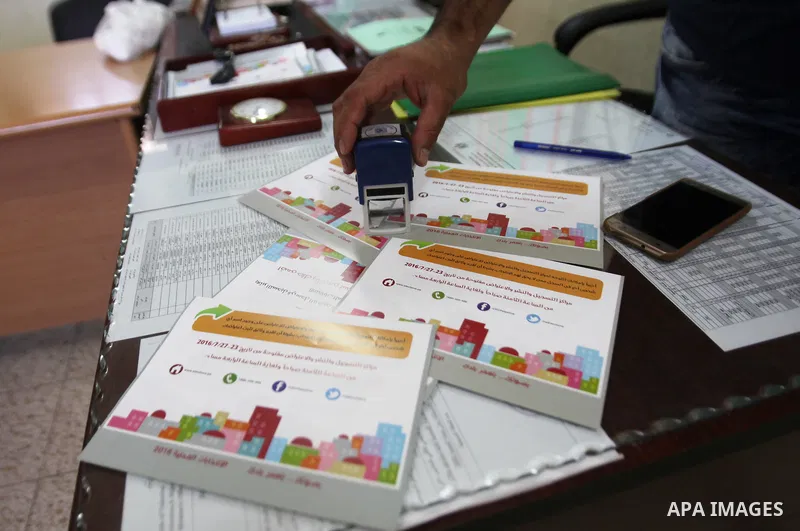 A Palestinian from Central Elections Commission (CEO) works at Voter registration centers in the West Bank city of Nablus on July 24, 2016. The Palestinian Central Elections Commission (CEO) announced Saturday that voter...