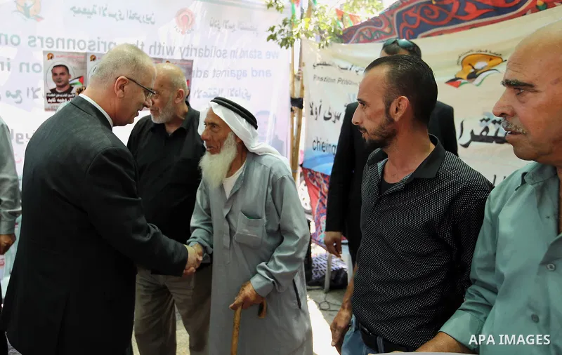 Palestinian Prime Minister, Rami Hamadallah, participates in the protest in solidarity with the prisoners on hunger strike in Manger Square, in the West Bank city of Bethleem, on July 24, 2016. Photo by Prime Minister Of...