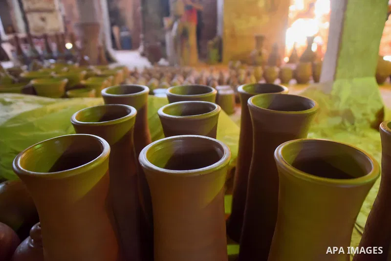 Pottery vessels are seen drying at a pottery workshop in Cairo, on July 24, 2016. Pottery is an ancient and traditional craft in Egypt. Local workshops usually produce products such as bowls, pitchers, flower pots, and v...