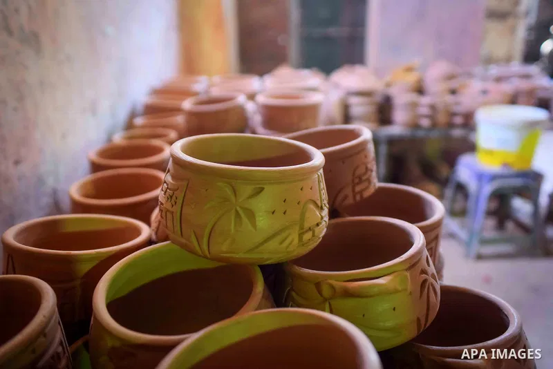 Pottery vessels are seen drying at a pottery workshop in Cairo, on July 24, 2016. Pottery is an ancient and traditional craft in Egypt. Local workshops usually produce products such as bowls, pitchers, flower pots, and v...