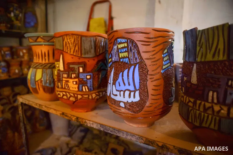 Pottery vessels are seen drying at a pottery workshop in Cairo, on July 24, 2016. Pottery is an ancient and traditional craft in Egypt. Local workshops usually produce products such as bowls, pitchers, flower pots, and v...
