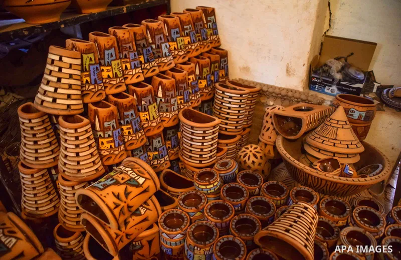 Pottery vessels are seen drying at a pottery workshop in Cairo, on July 24, 2016. Pottery is an ancient and traditional craft in Egypt. Local workshops usually produce products such as bowls, pitchers, flower pots, and v...