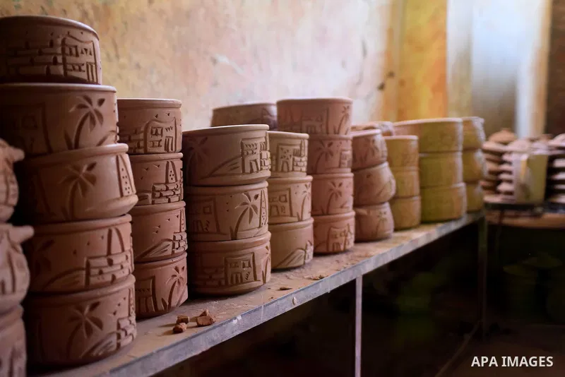 Pottery vessels are seen drying at a pottery workshop in Cairo, on July 24, 2016. Pottery is an ancient and traditional craft in Egypt. Local workshops usually produce products such as bowls, pitchers, flower pots, and v...