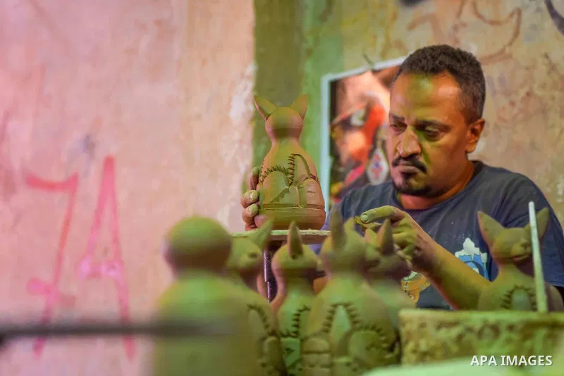 An Egyptian man works at a pottery workshop in Cairo, on July 24, 2016. Pottery is an ancient and traditional craft in Egypt. Local workshops usually produce products such as bowls, pitchers, flower pots, and vases. Phot...