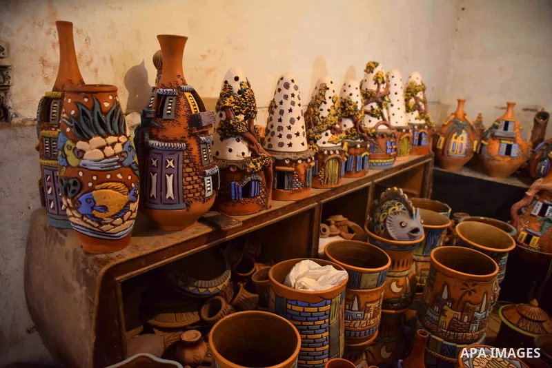 Pottery vessels are seen drying at a pottery workshop in Cairo, on July 24, 2016. Pottery is an ancient and traditional craft in Egypt. Local workshops usually produce products such as bowls, pitchers, flower pots, and v...