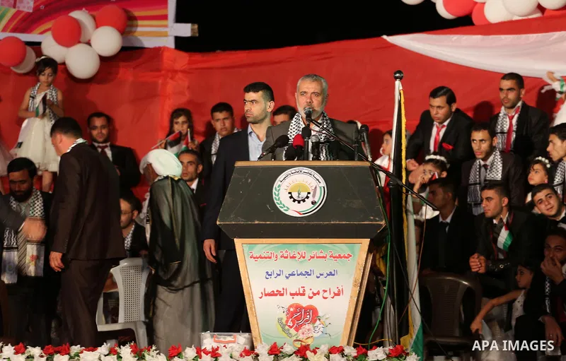 Senior Hamas leader Ismail Haniyeh speaks during a mass wedding for 340 couples organized by Hamas movement in Beit Lahiya town in the northern Gaza Strip July 24, 2016. Photo by Mohammed Asad