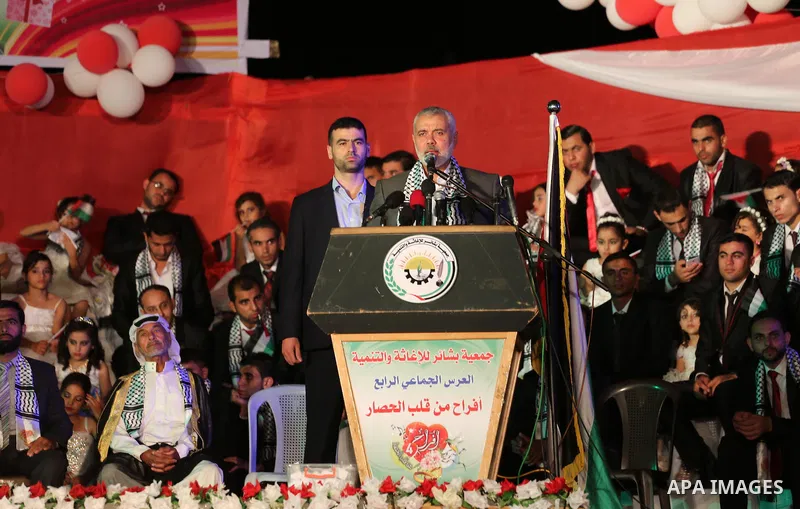 Senior Hamas leader Ismail Haniyeh speaks during a mass wedding for 340 couples organized by Hamas movement in Beit Lahiya town in the northern Gaza Strip July 24, 2016. Photo by Mohammed Asad