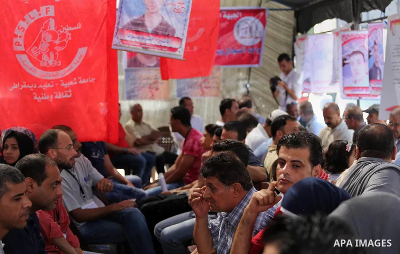 Supporters of the Popular Front for the Liberation of Palestine (PFLP) take part in a protest demanding for the release of Bilal Kayed a Palestinian prisoner on hunger strike,, in front of Red cross office, in Gaza city...