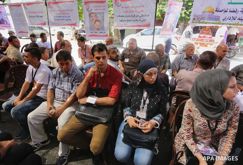 Supporters of the Popular Front for the Liberation of Palestine (PFLP) take part in a protest demanding for the release of Bilal Kayed a Palestinian prisoner on hunger strike,, in front of Red cross office, in Gaza city...