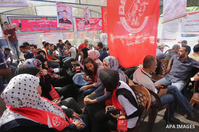 Supporters of the Popular Front for the Liberation of Palestine (PFLP) take part in a protest demanding for the release of Bilal Kayed a Palestinian prisoner on hunger strike,, in front of Red cross office, in Gaza city...