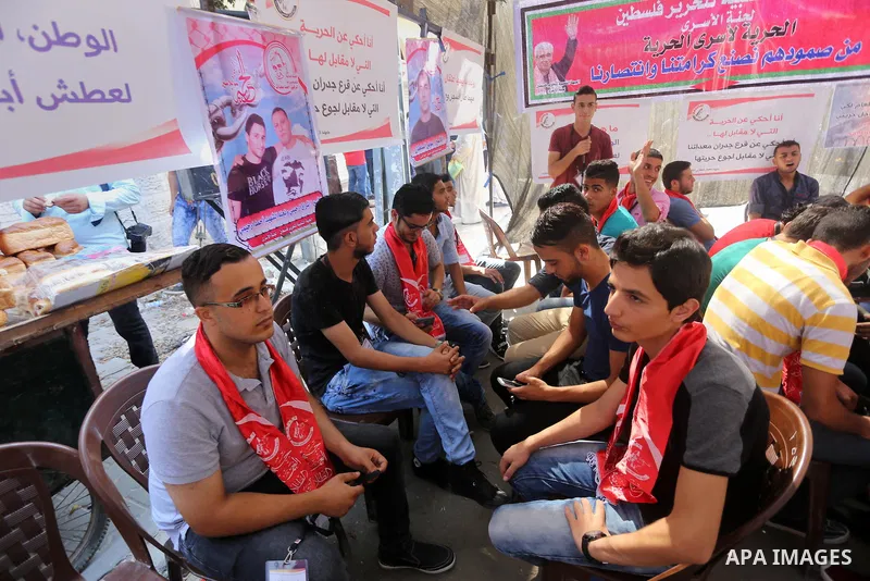 Supporters of the Popular Front for the Liberation of Palestine (PFLP) take part in a protest demanding for the release of Bilal Kayed a Palestinian prisoner on hunger strike,, in front of Red cross office, in Gaza city...
