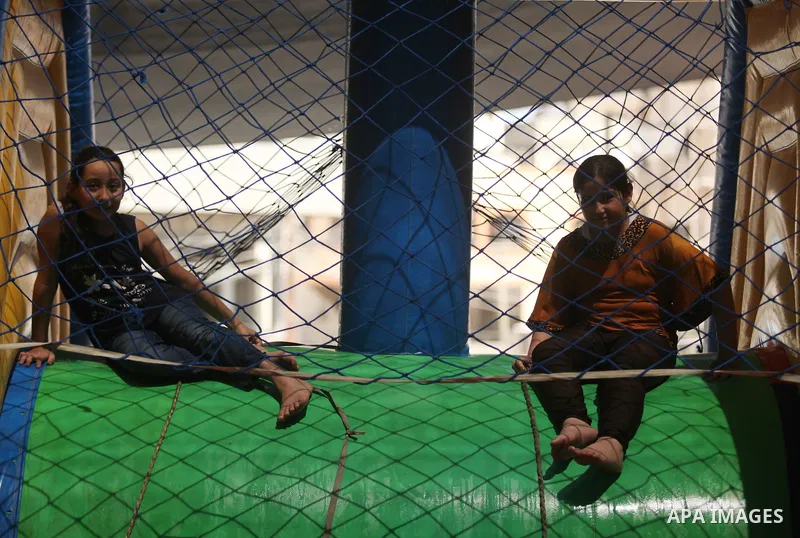 Palestinian schoolgirls enjoy as part of the activities proposed during a summer camp organised by the United Nations on July 25, 2016 in Gaza City. Photo by Ashraf Amra