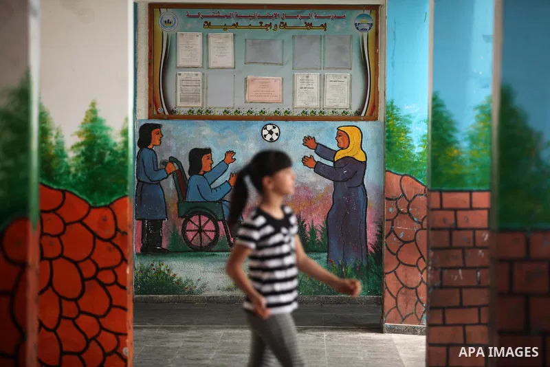 Palestinian schoolgirls enjoy as part of the activities proposed during a summer camp organised by the United Nations on July 25, 2016 in Gaza City. Photo by Ashraf Amra