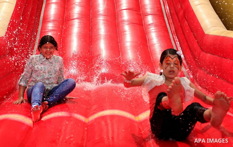 Palestinian schoolgirls enjoy as part of the activities proposed during a summer camp organised by the United Nations on July 25, 2016 in Gaza City. Photo by Ashraf Amra