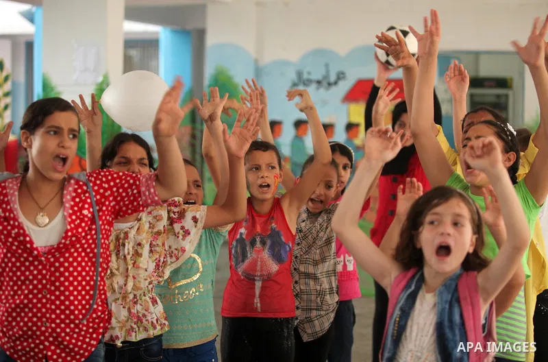 Palestinian schoolgirls enjoy as part of the activities proposed during a summer camp organised by the United Nations on July 25, 2016 in Gaza City. Photo by Ashraf Amra