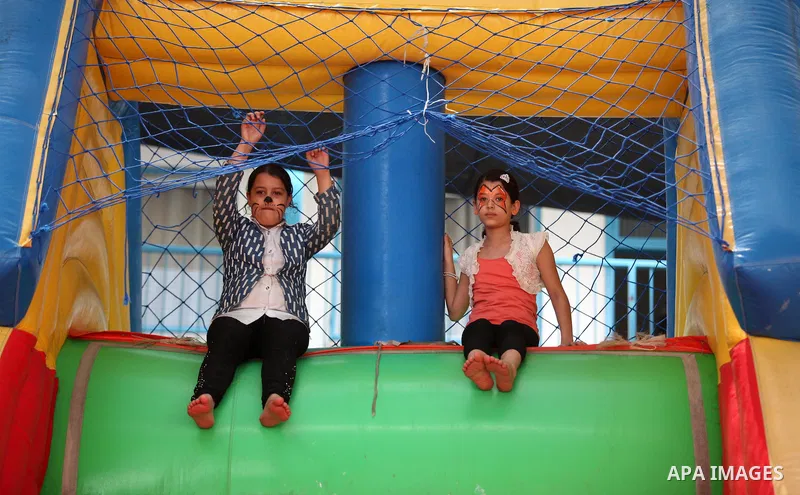Palestinian schoolgirls enjoy as part of the activities proposed during a summer camp organised by the United Nations on July 25, 2016 in Gaza City. Photo by Ashraf Amra