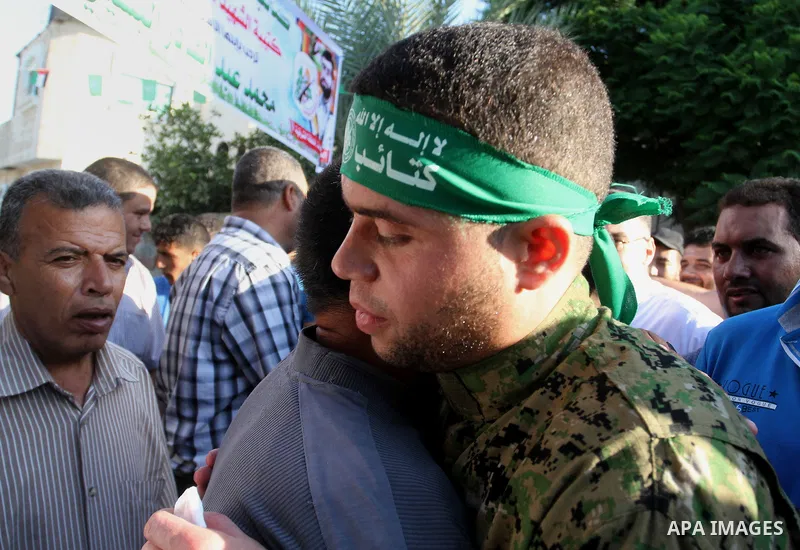 Freed Palestinian prisoner Mohammed al-Bashiti, who served 12 years in an Israeli jail after he was convicted of being a member of Hamas's armed wing is welcomed by relatives in Rafah in the southern Gaza Strip, July 25,...