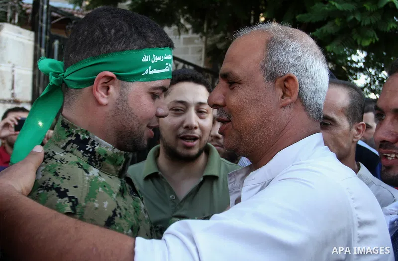 Freed Palestinian prisoner Mohammed al-Bashiti, who served 12 years in an Israeli jail after he was convicted of being a member of Hamas's armed wing is welcomed by relatives in Rafah in the southern Gaza Strip, July 25,...