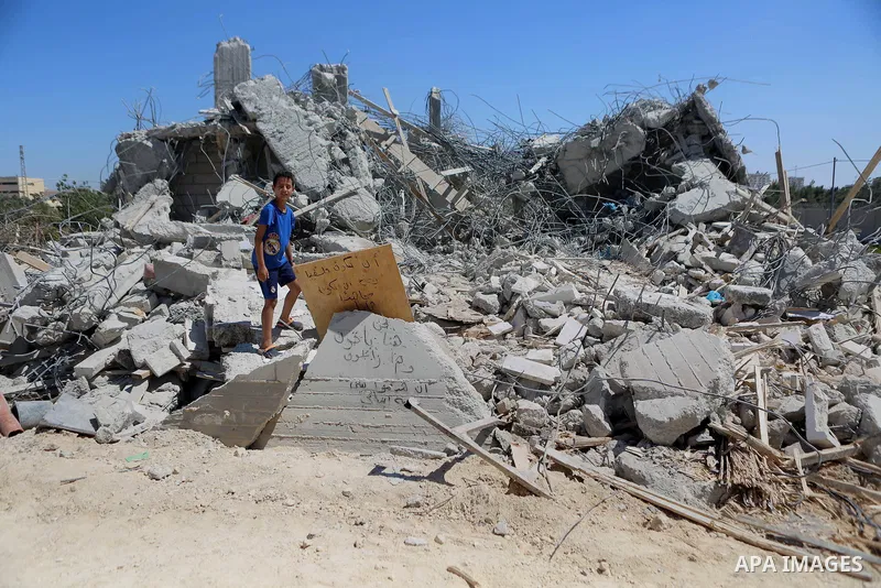 Palestinians inspect the rubble of a Palestinian house after it was demolished by Israeli troops in the West Bank village of Qalandia near Ramallah July 26, 2016. Photo by Shadi Hatem