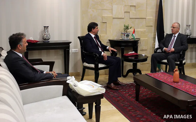 Palestinian Prime Minister Rami Hamdallah meets with Anwar Abdul Hadi, head of the political department at the PLO office in Syria, in the West Bank city of Ramallah on July 26, 2016. Photo by Prime Minister Office