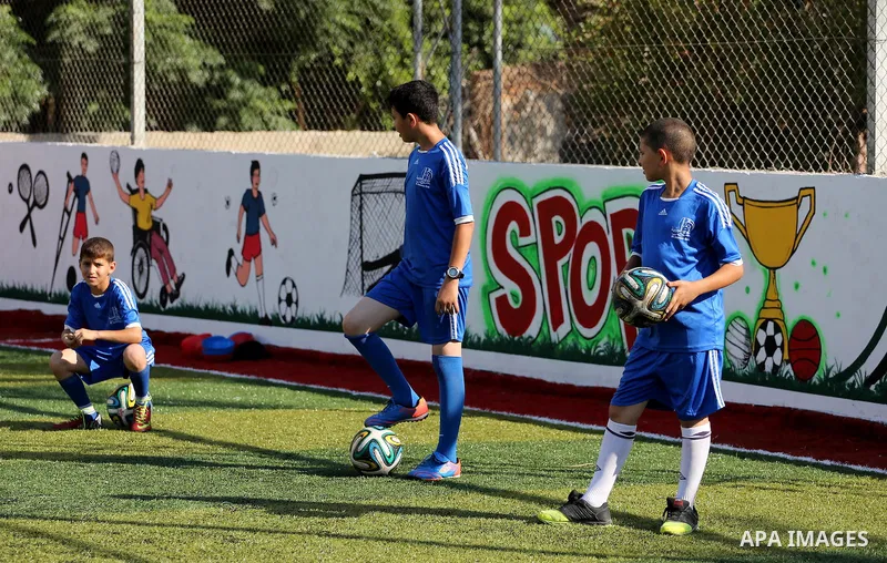 Palestinian boys take part in a training season for football school at Al Jazeera club in Gaza city, on July 26, 2016. Photo by Mohammed Asad