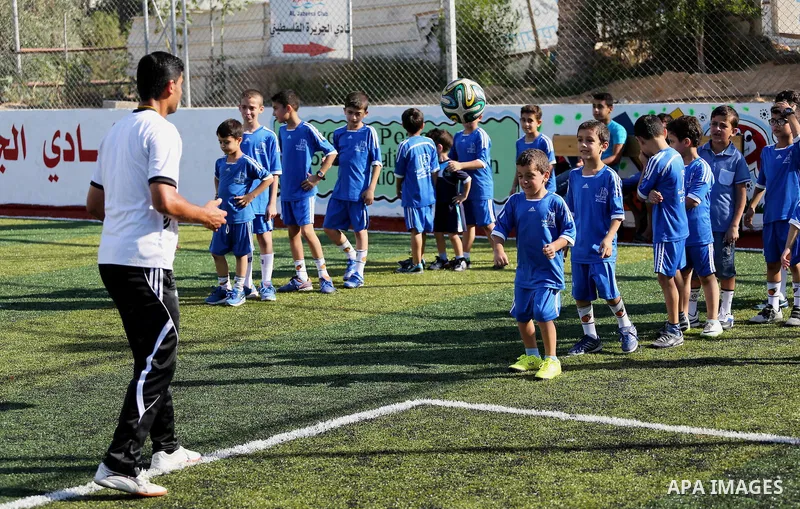 Palestinian boys take part in a training season for football school at Al Jazeera club in Gaza city, on July 26, 2016. Photo by Mohammed Asad