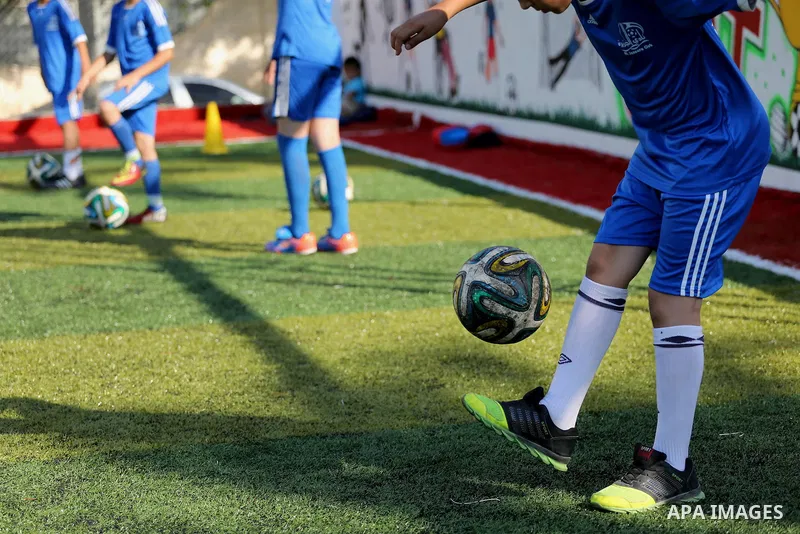 Palestinian boys take part in a training season for football school at Al Jazeera club in Gaza city, on July 26, 2016. Photo by Mohammed Asad
