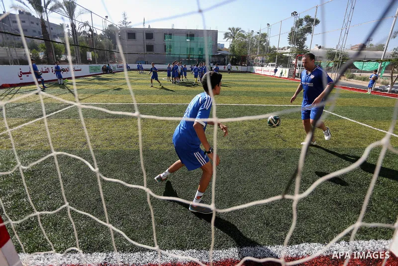 Palestinian boys take part in a training season for football school at Al Jazeera club in Gaza city, on July 26, 2016. Photo by Mohammed Asad