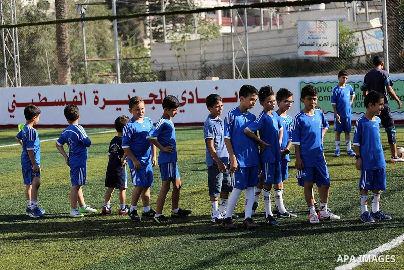 Palestinian boys take part in a training season for football school at Al Jazeera club in Gaza city, on July 26, 2016. Photo by Mohammed Asad