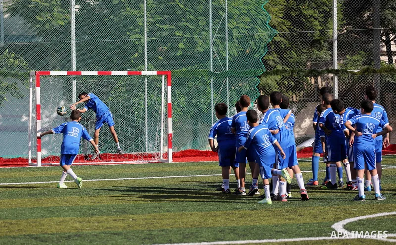Palestinian boys take part in a training season for football school at Al Jazeera club in Gaza city, on July 26, 2016. Photo by Mohammed Asad
