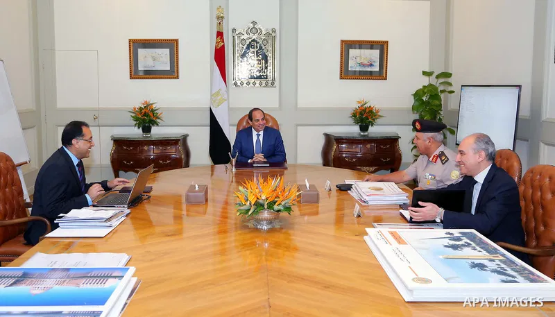 Egyptian President Abdel Fattah al-Sisi meets with Mostafa Madbouly Housing Minister and Kamel al-Wazeer a head of Engineering Authority in Cairo, Egypt, on July 26, 2016. Photo by Egyptian President Office