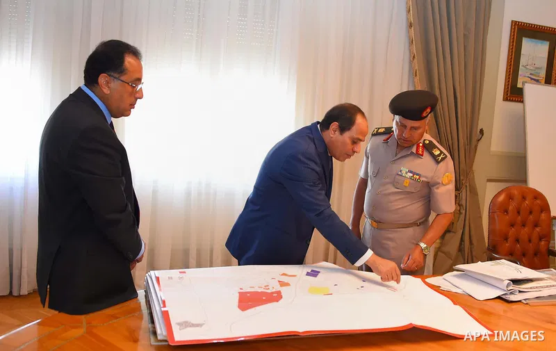 Egyptian President Abdel Fattah al-Sisi meets with Mostafa Madbouly Housing Minister and Kamel al-Wazeer a head of Engineering Authority in Cairo, Egypt, on July 26, 2016. Photo by Egyptian President Office