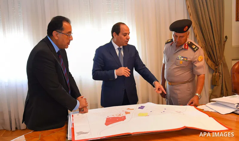 Egyptian President Abdel Fattah al-Sisi meets with Mostafa Madbouly Housing Minister and Kamel al-Wazeer a head of Engineering Authority in Cairo, Egypt, on July 26, 2016. Photo by Egyptian President Office