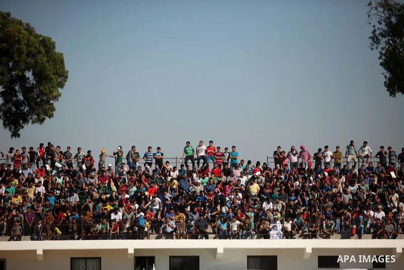 Palestinian spectators watch the first leg of the Palestine Cup final soccer match between Gaza Strip's Khan Younis Youth and Hebron's Al-Ahly at al-Yarmouk stadium in Gaza City July 26, 2016. Photo by Ashraf Amra