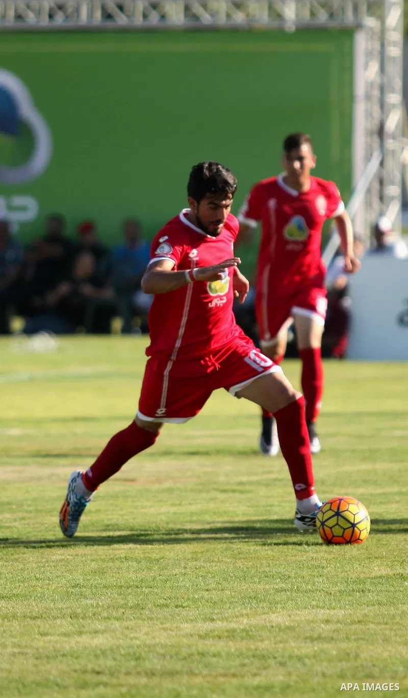 Palestinian Gaza Strip's Khan Younis Youth and Hebron's players compete during the first leg of the Palestine Cup final soccer match at al-Yarmouk stadium in Gaza City July 26, 2016. Photo by Ashraf Amra
