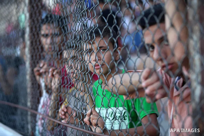 Palestinian spectators watch the first leg of the Palestine Cup final soccer match between Gaza Strip's Khan Younis Youth and Hebron's Al-Ahly at al-Yarmouk stadium in Gaza City July 26, 2016. Photo by Ashraf Amra