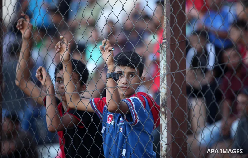 Palestinian spectators watch the first leg of the Palestine Cup final soccer match between Gaza Strip's Khan Younis Youth and Hebron's Al-Ahly at al-Yarmouk stadium in Gaza City July 26, 2016. Photo by Ashraf Amra