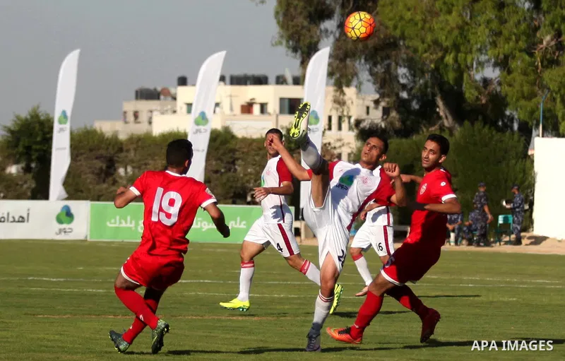 Palestinian Gaza Strip's Khan Younis Youth and Hebron's players compete during the first leg of the Palestine Cup final soccer match at al-Yarmouk stadium in Gaza City July 26, 2016. Photo by Ashraf Amra
