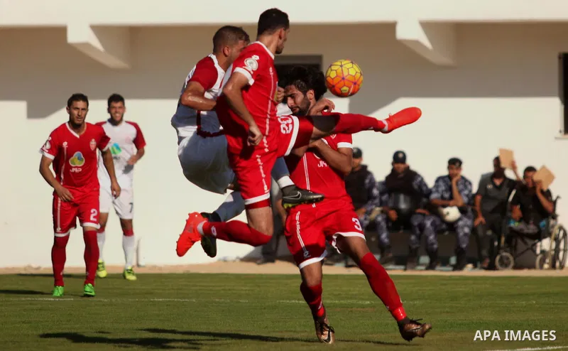 Palestinian Gaza Strip's Khan Younis Youth and Hebron's players compete during the first leg of the Palestine Cup final soccer match at al-Yarmouk stadium in Gaza City July 26, 2016. Photo by Ashraf Amra