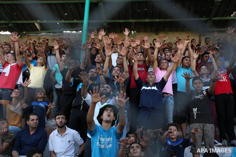 Palestinian spectators watch the first leg of the Palestine Cup final soccer match between Gaza Strip's Khan Younis Youth and Hebron's Al-Ahly at al-Yarmouk stadium in Gaza City July 26, 2016. Photo by Ashraf Amra