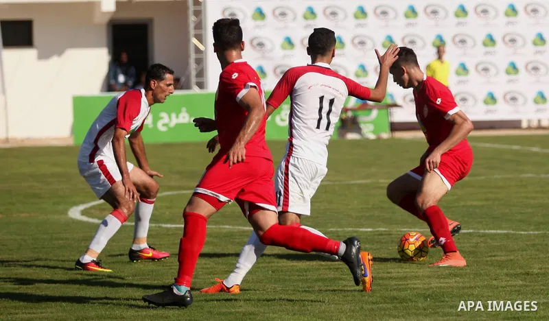 Palestinian Gaza Strip's Khan Younis Youth and Hebron's players compete during the first leg of the Palestine Cup final soccer match at al-Yarmouk stadium in Gaza City July 26, 2016. Photo by Ashraf Amra