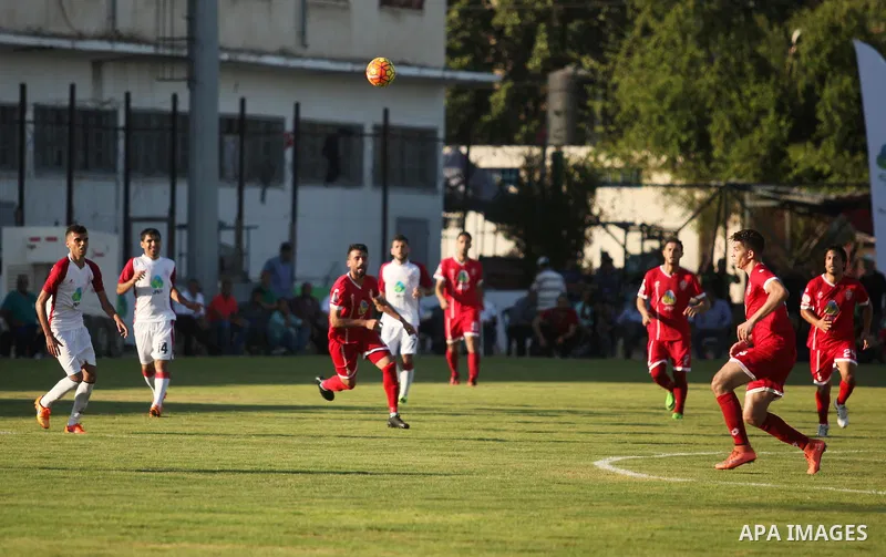 Palestinian Gaza Strip's Khan Younis Youth and Hebron's players compete during the first leg of the Palestine Cup final soccer match at al-Yarmouk stadium in Gaza City July 26, 2016. Photo by Ashraf Amra