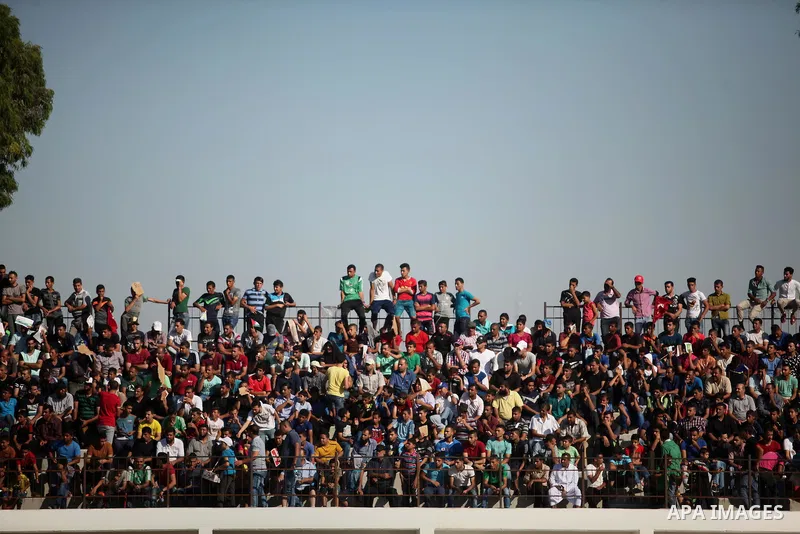 Palestinian spectators watch the first leg of the Palestine Cup final soccer match between Gaza Strip's Khan Younis Youth and Hebron's Al-Ahly at al-Yarmouk stadium in Gaza City July 26, 2016. Photo by Ashraf Amra