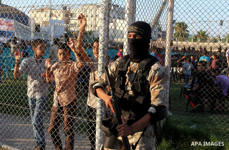 Palestinian militants from the Al-Quds Brigades, the armed wing of the Islamic Jihad movement, take part in a rally in Rafah in the southern Gaza Strip on July 28, 2016. Photo by Abed Rahim Khatib