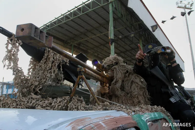 Palestinian militants from the Al-Quds Brigades, the armed wing of the Islamic Jihad movement, take part in a rally in Rafah in the southern Gaza Strip on July 28, 2016. Photo by Abed Rahim Khatib