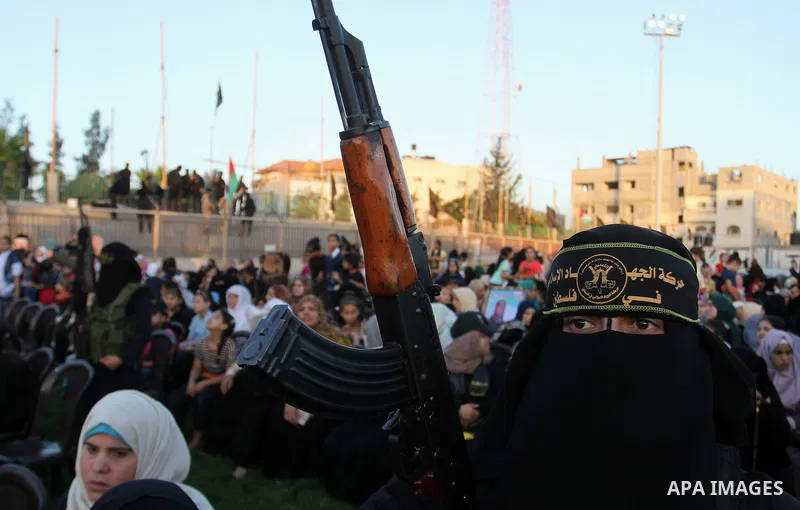 Palestinian female militants from the Al-Quds Brigades, the armed wing of the Islamic Jihad movement, take part in a rally in Rafah in the southern Gaza Strip on July 28, 2016. Photo by Abed Rahim Khatib